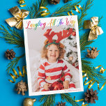 Laughing All The Way Rainbow Kids Christmas Photo Holiday Card<br><div class="desc">Beautiful,  colourful full photo Christmas card with Laughing All the Way in pretty rainbow cursive script. Personalise with your favourite vertical family photograph of your smiling child above your name or custom greeting in red. Fun and cheerful holiday cards with a 2nd full picture on the back.</div>