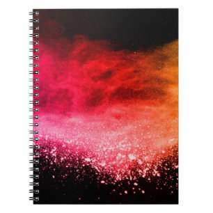 Launched colourful powder, isolated on black backg notebook
