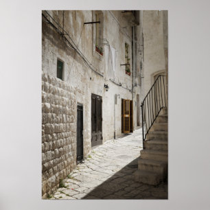 Laundry hanging to dry in an alley in Italy Poster