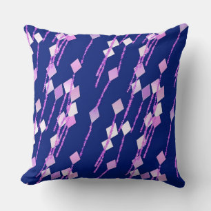 lavender and pink kites against dark blue cushion