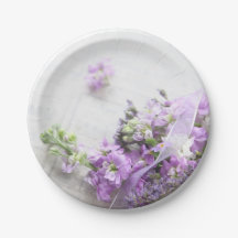 Lavender-coloured flowers on old music