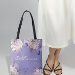 Lavender Floral Spring Wedding Bridesmaids Gift Tote Bag<br><div class="desc">Watercolor floral designs have become increasingly popular in the world of weddings. This design features soft, delicate watercolor strokes in white and lavender colour that evoke a sense of romanticism and elegance. The combination of pastel and vibrant colours gives this wedding suite a dreamy and whimsical feel, making it perfect...</div>