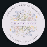 Lavender Wildflower Meadow Bridal shower thank you Classic Round Sticker<br><div class="desc">This elegant lavender bridal shower favor sticker features delicate wildflower blooms in soft pastel tones arranged in a romantic botanical cluster. The muted purple background paired with airy meadow florals creates a whimsical yet minimalist look, perfect for a chic and modern celebration. Designed to add a polished finishing touch to...</div>