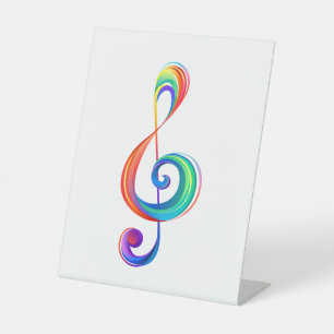 Layered rainbow treble clef pedestal sign