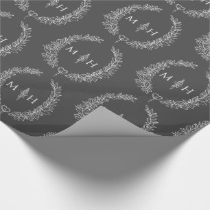 Leaf oval monogram drawing dark grey on white wrapping paper