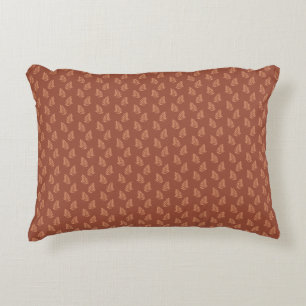 Leaf pattern on warm brown background, decorative cushion
