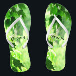 Leafy Wedding Groom Flip Flops<br><div class="desc">These Groom wedding flip flops invite you to enter a leafy summer world of nature. Maple leaves frame a sunny woodland forest scene with shades of yellow,  white and green.  Customise the text for your special occasion.</div>