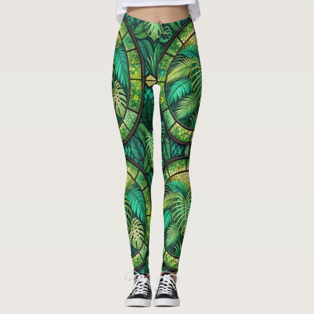 Leggings featuring a vibrant green tropical leaf  (Front)