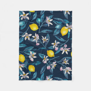 Lemon branches with blossoms and fruit on blue fleece blanket