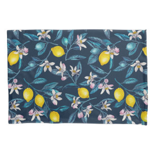 Lemon branches with blossoms and fruit on blue pillowcase