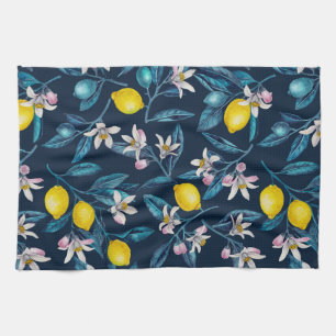 Lemon branches with blossoms and fruit on blue tea towel