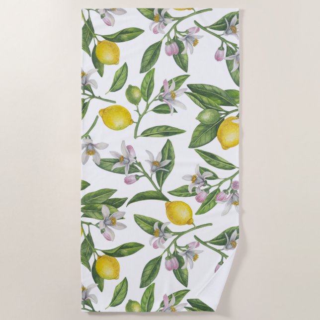 Lemon branches with blossoms and fruit on white beach towel (Front)