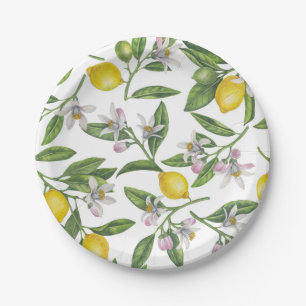 Lemon branches with blossoms and fruit on white paper plate