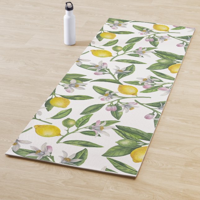 Lemon branches with blossoms and fruit on white yoga mat (In Situ)