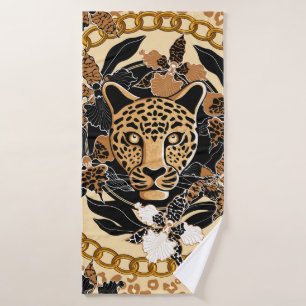 leopard's head surrounded by orchids, gold chain a bath towel