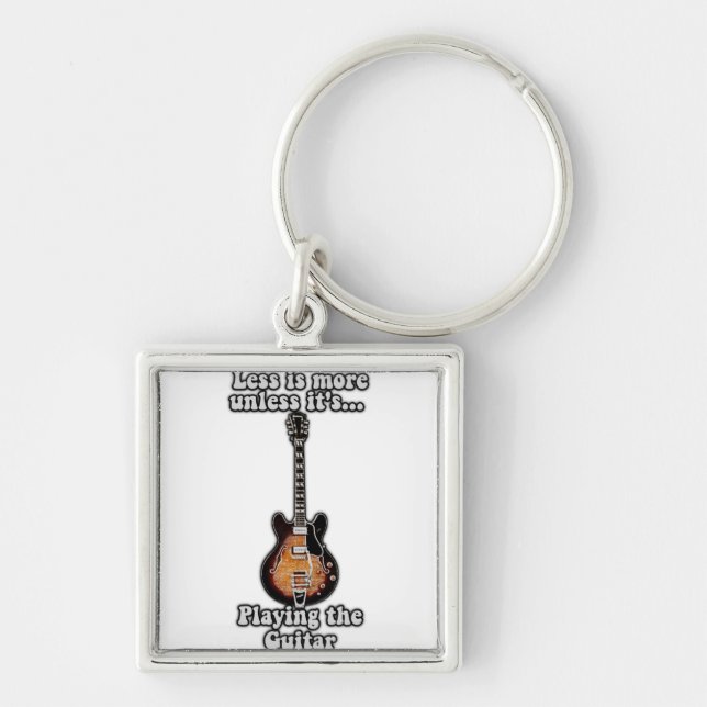 Less is more unless it's playing the guitar. brown key ring (Front)