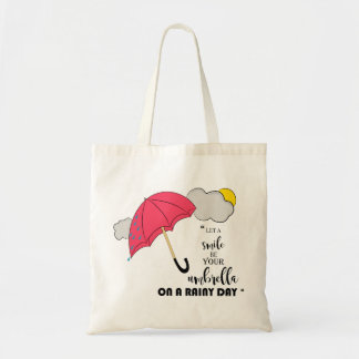 let a smile be your umbrella on a rainy day tote bag
