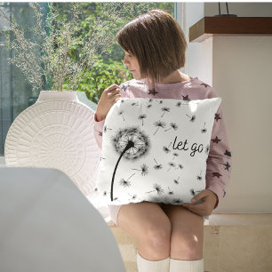 Let go, dandelion seed flowing in the wind cushion