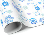 Let It Snow- White Wrapping Paper<br><div class="desc">Snowflakes in shades of blue dance over this festive wrapping paper.  Between the flakes are the words,  "Let It Snow!".  Also available in other colours.</div>