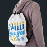 Let's Get Lit! Backpack<br><div class="desc">This cheeky Hanukkah pattern is an eye-catcher! It's a fun and funky way to dress up decor, gifts, apparel, and household items for the occasion. Check out my store for more pattern items and gift ideas, or combine items to create an interesting gift package!</div>