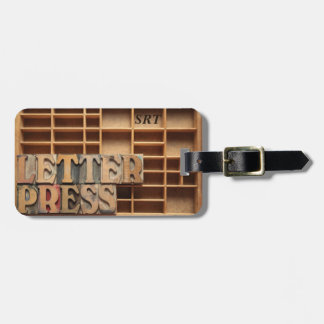 Letterpress word on type case luggage tag