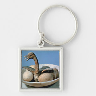 Lid of an alabaster jar decorated with a bird key ring