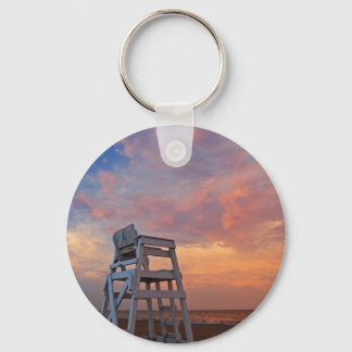 Lifeguard chair with dramatic sky. key ring