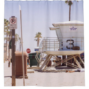 Lifeguard houses under bright skty shower curtain