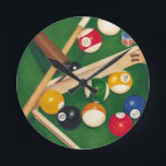 Lifelike Billiards Table with Balls and Chalk Round Clock<br><div class="desc">Rack 'em up with this spectacular painting of a billiards table by Jennifer Goldberger. The balls look new, the felt looks immaculate, and the chalk has already been applied to the cue sticks. Hang this in your home, or gift it to a friend or loved one who enjoys a game...</div>
