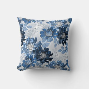 Light blue, dark blue flowers on light grey cushion