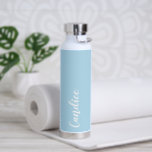 Light Blue Personalised Wedding Bridesmaid Water Bottle<br><div class="desc">Gift your wedding bridesmaid or maid of honour with this trendy, vacuum Insulated water bottle that features her name in white, stylised script on a light blue colour background designed to match your wedding colour scheme. Personalise bottle by editing and replacing name with your own as desired. Select your water...</div>
