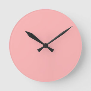 Light coral pink background round clock