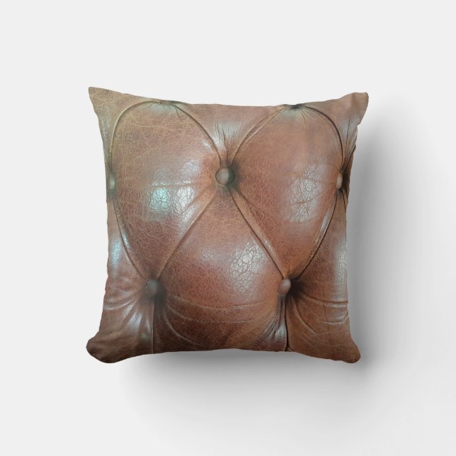 Light on brown leather sofa surface, textureabstra cushion (Front)