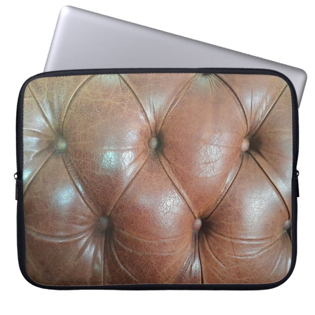 Light on brown leather sofa surface, textureabstra laptop sleeve (Front)