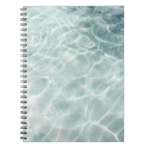 Light reflected on water at daytime notebook