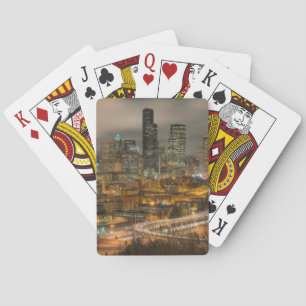 Light streaks from cars at night playing cards