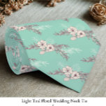 Light Teal Floral Wedding  Neck Tie<br><div class="desc">Add a refined touch to your wedding attire with this light teal floral wedding necktie, designed for timeless elegance. The soft teal backdrop paired with delicate floral detailing creates a sophisticated yet romantic look, perfect for grooms, groomsmen, or special guests. Its versatile shade complements a wide range of suit colours,...</div>