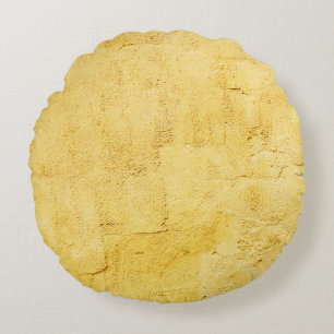 light yellow abstract textured plaster on the wall round cushion