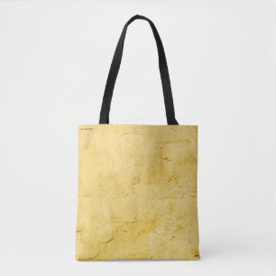 light yellow abstract textured plaster on the wall tote bag
