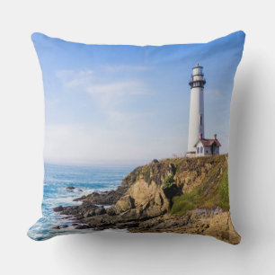 Lighthouse on hill blue sky white house ocean cushion
