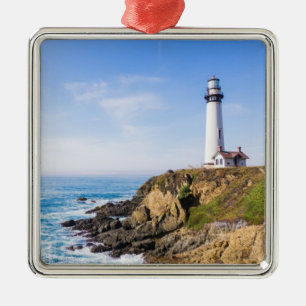 Lighthouse on hill blue sky white house ocean metal tree decoration