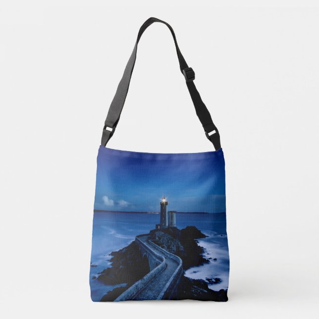 Lighthouse on wall in ocean at night crossbody bag (Back)