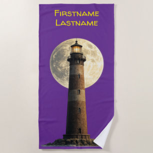 Lighthouse with a full moon beach towel