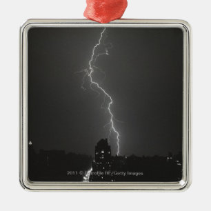 Lightning over city metal tree decoration