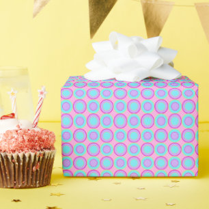 Lilac And Turquoise Doughnuts With Filling On Pink Wrapping Paper