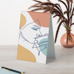 line art drawing poster of woman drinking coffee