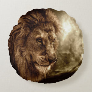 Lion against stormy sky round cushion
