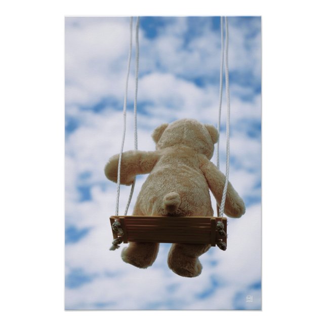 Little bear on a swing with a cloudy blue sky. poster (Front)