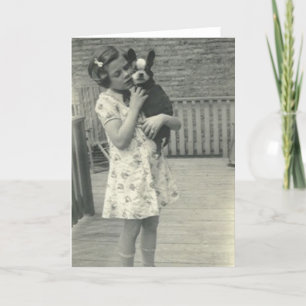 Little girl holding her dog greeting card