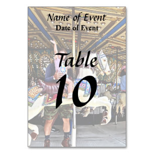 Little Girl Waving Hi From Carousel Table Number